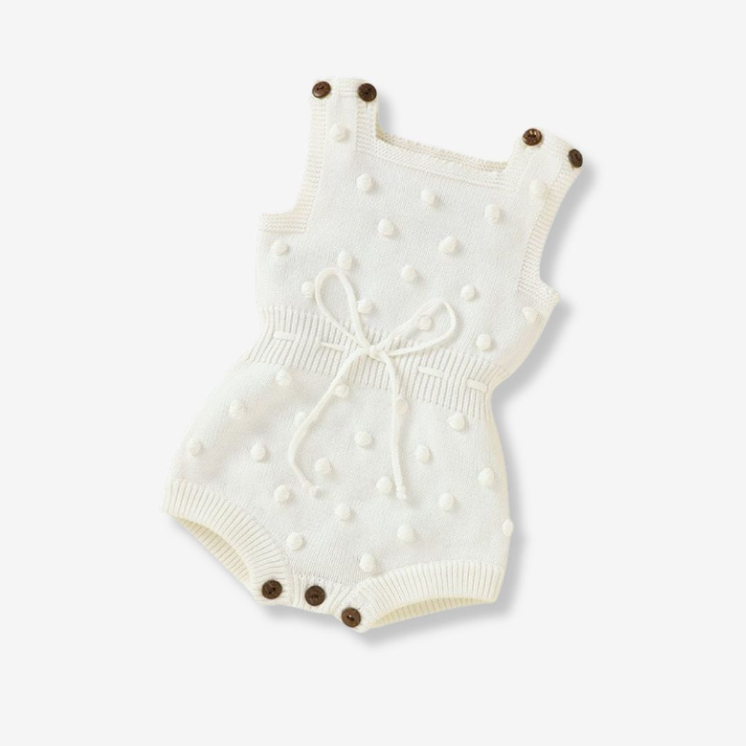 Ärmelloser Baby-Strickstrampler mit Plüsch-Bommeln